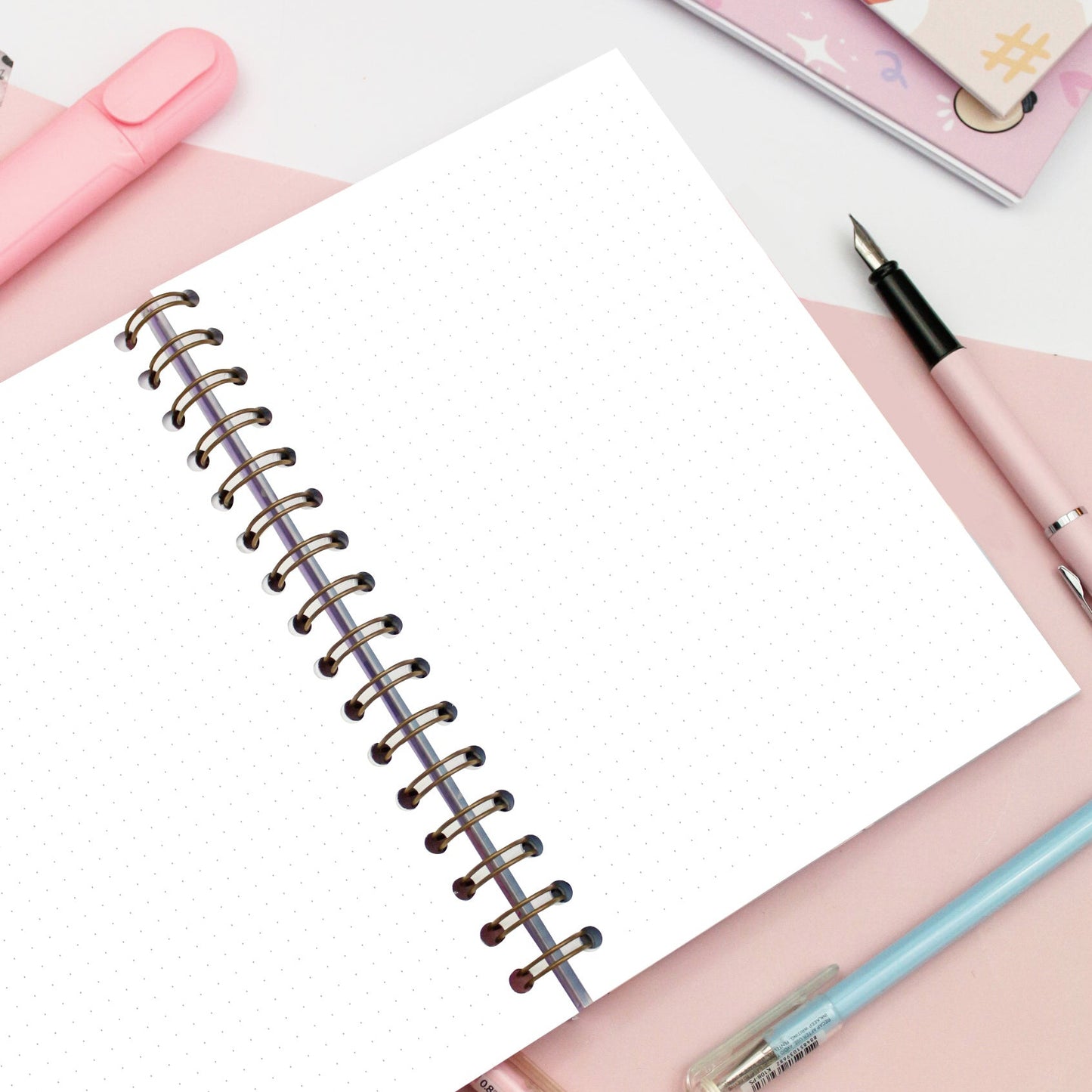 bullet journal with dotted pages and spiral binding