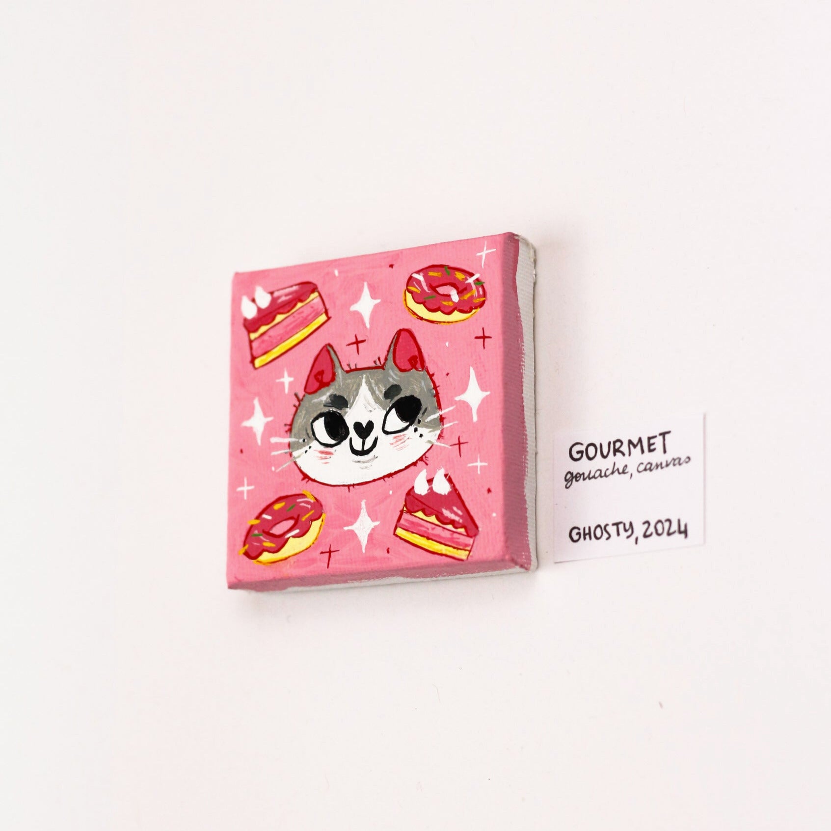 tiny gouache painting of a cat on a pink background